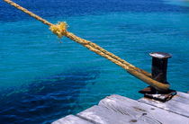 Rope on mooring post by Sami Sarkis Photography