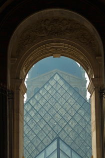 The pyramid of the Musée du Louvre seen through an arched window by Sami Sarkis Photography