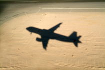 Shadow of airplane flying into land at Hurghada Airport by Sami Sarkis Photography
