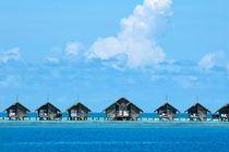 Resort bungalows over sea by Sami Sarkis Photography