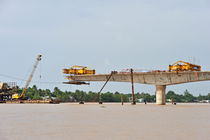 Road bridge under construction over Mekong river by Sami Sarkis Photography