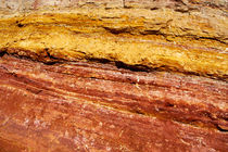 Red and yellow sandy rock face from a canyon in Rustrel by Sami Sarkis Photography