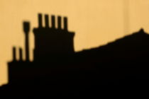 Chimneys silhouetted against the evening sky von Sami Sarkis Photography