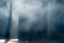 Smoke and sunlight mingle on a street in Trinidad von Sami Sarkis Photography