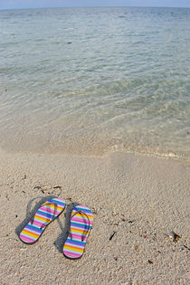 Flip-flops on beach by Sami Sarkis Photography