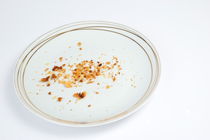 Cookies crumbs in an empty plate by Sami Sarkis Photography