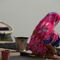 Woman-in-pink-sari-by-ganges