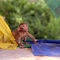 Baby-monkey-playing-on-prayer-flags-swayambhu-steps-04