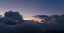 First Hint of Sunrise through Clouds at Poon Hill by serenityphotography