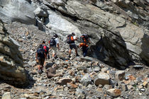 Trekkers Climbing over Landslide by serenityphotography