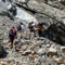 Trekkers-climbing-over-landslide