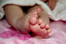 Delicate Baby's Foot by serenityphotography