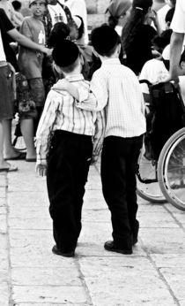 Two brothers in the heart of Jerusalem, near to a Wailing Wall, Israel by yulia-dubovikova