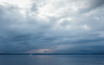 Cloudy blue sky over Puget Sound von Ron Greer