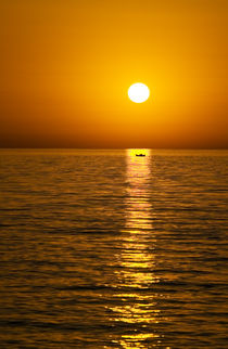 greek island sunset with boat von meirion matthias