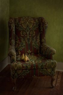 three pears sitting in a wing chair by Priska  Wettstein