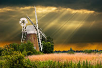 windmill with sunbeams by meirion matthias