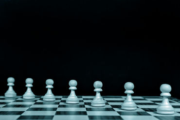 Playing-pawns-diagonally-on-a-chessboard-black-background-3