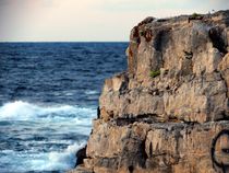 rocky cliffs and blue sea by nessie